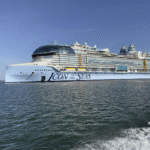 Royal Caribbean cruise ship sailing in the ocean with onboard entertainment and luxury amenities