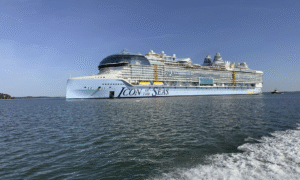 Royal Caribbean cruise ship sailing in the ocean with onboard entertainment and luxury amenities